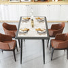 Sintered stone dining table with golden metal frame, stylish faux marble top, perfect for indoor dining and gatherings.