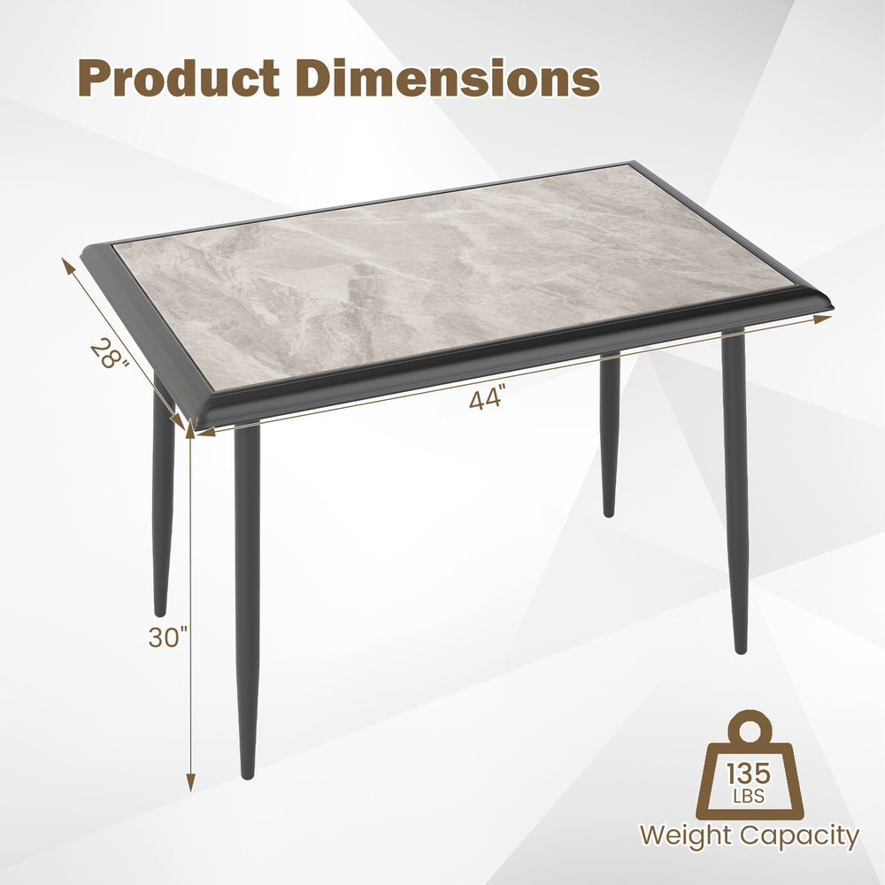 Rectangular sintered stone dining table with golden metal frame, measuring 44" x 30", ideal for modern kitchens and.