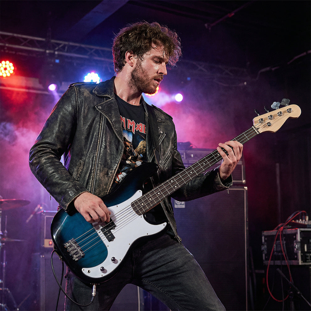 Electric bass guitar in blue with double pickups, ideal for beginners, featuring solid wood construction and gig bag.