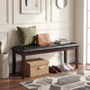 Brown PU leather upholstered bench with padded seat and rubber wood legs, ideal for shoe storage and versatile seating.