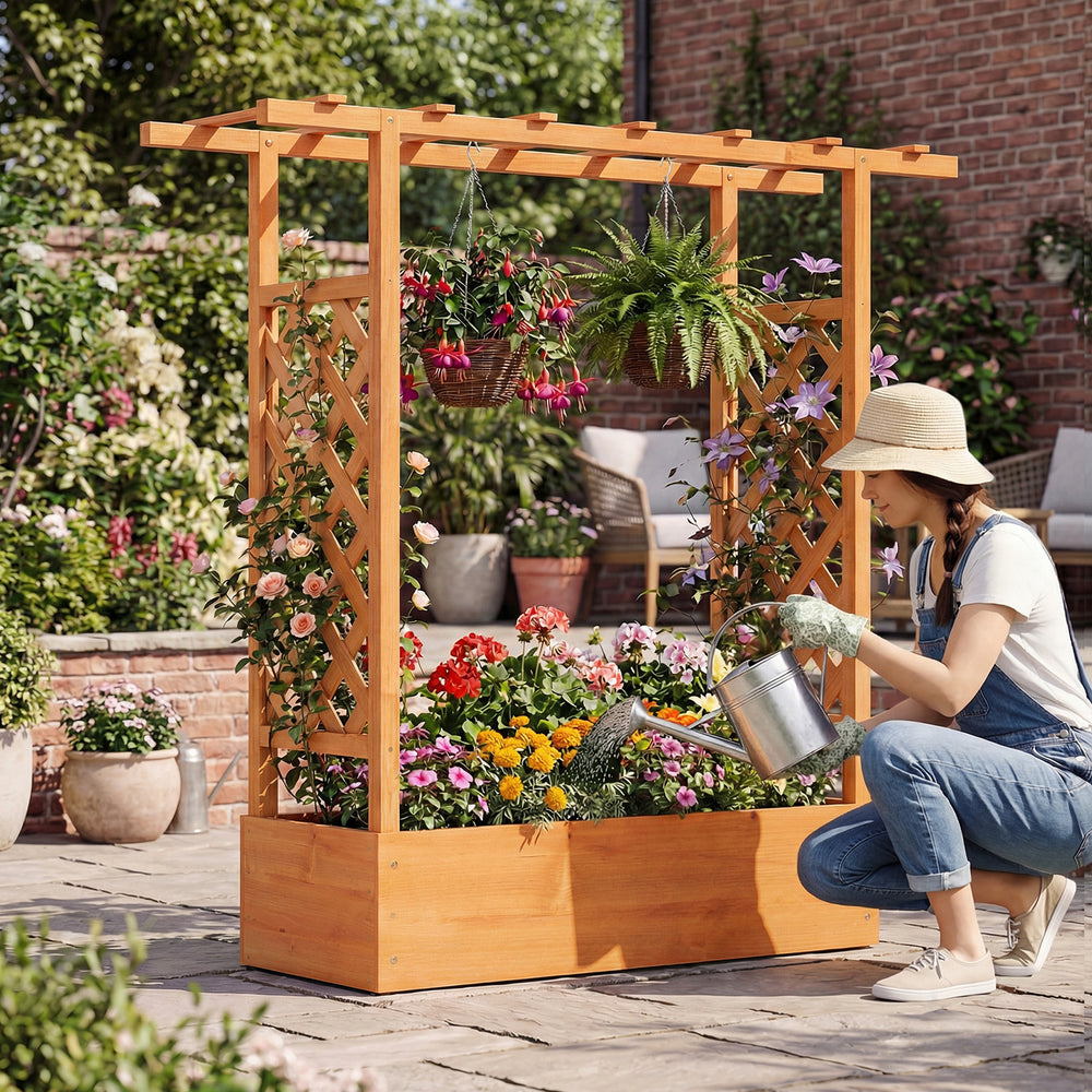Wooden raised garden bed with side trellis and hanging roof, ideal for growing flowers and plants in outdoor spaces.