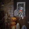 Animated 18-inch hanging skull prisoner decoration with sinister movements and light-up eyes, ideal for chilling.