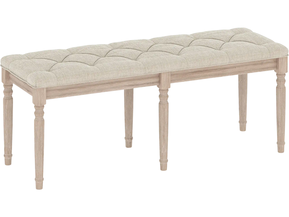 Upholstered bench with button-tufted beige seat and carved rubber wood legs, perfect for entryway or living room.
