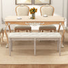 Upholstered bench with carved rubber wood legs, button-tufted seat, suitable for dining or living room use.