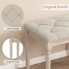 Elegant upholstered bench with button-tufted beige seat and carved rubber wood legs, perfect for entryway or living.