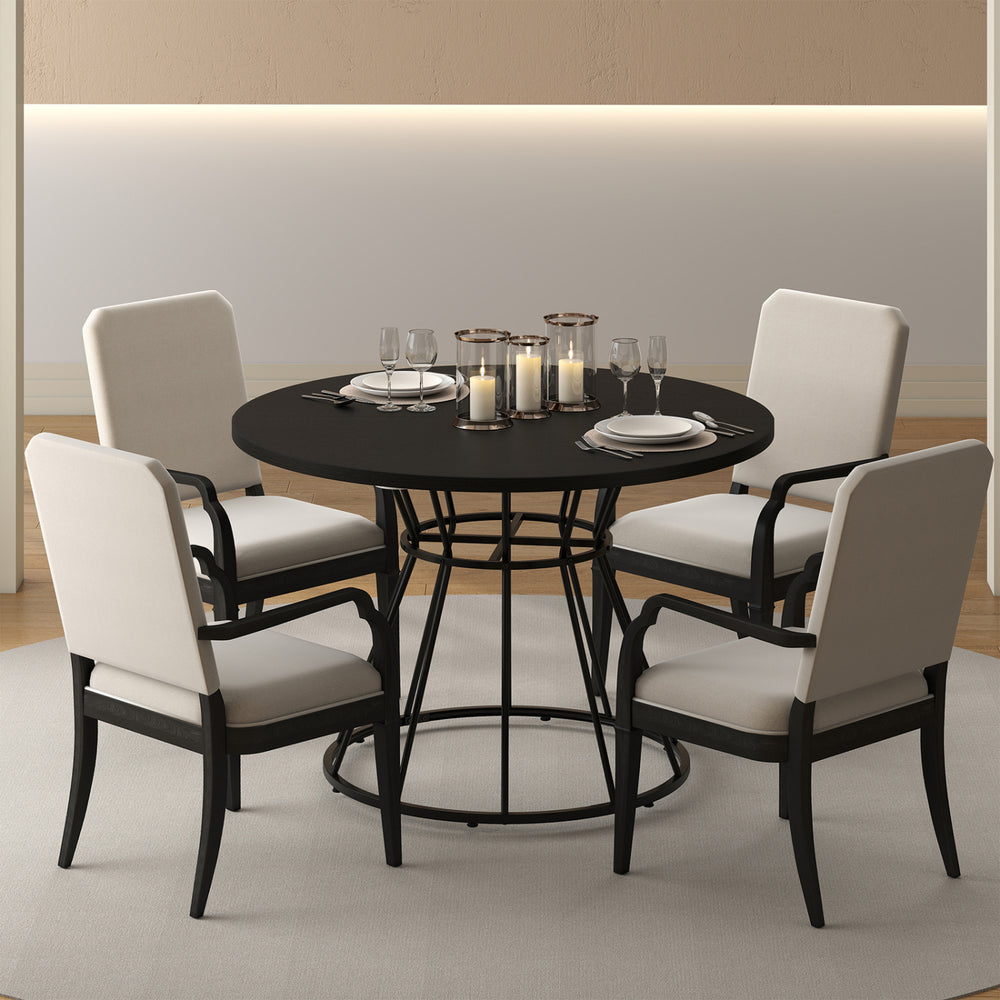 Round dining table with black wooden tabletop and metal frame, seating 4, ideal for modern kitchens and gatherings.