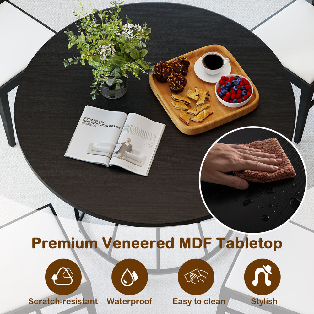 Round dining table with a black MDF tabletop, scratch-resistant and waterproof, perfect for 4-person gatherings.