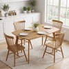 Natural 47" solid wood dining table with rounded edges, seats 4 people, perfect for family dinners in any setting.