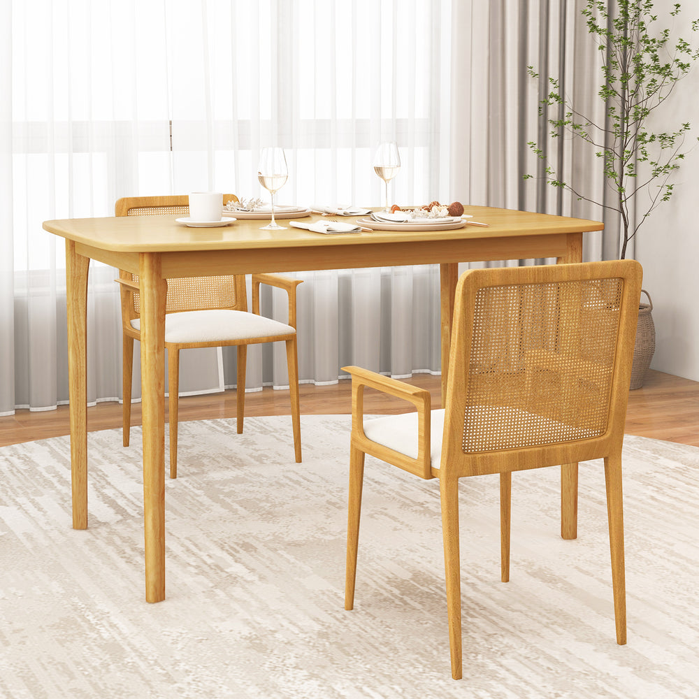 Solid wood dining table with rubber wood legs, natural finish, and round corners, perfect for kitchen dining.