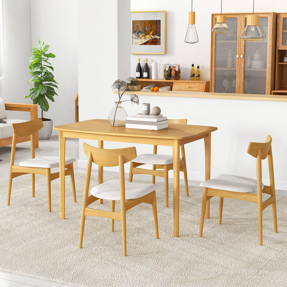 Solid wood dining table with rubber wood legs, natural finish, and spacious design for kitchen dining room use.
