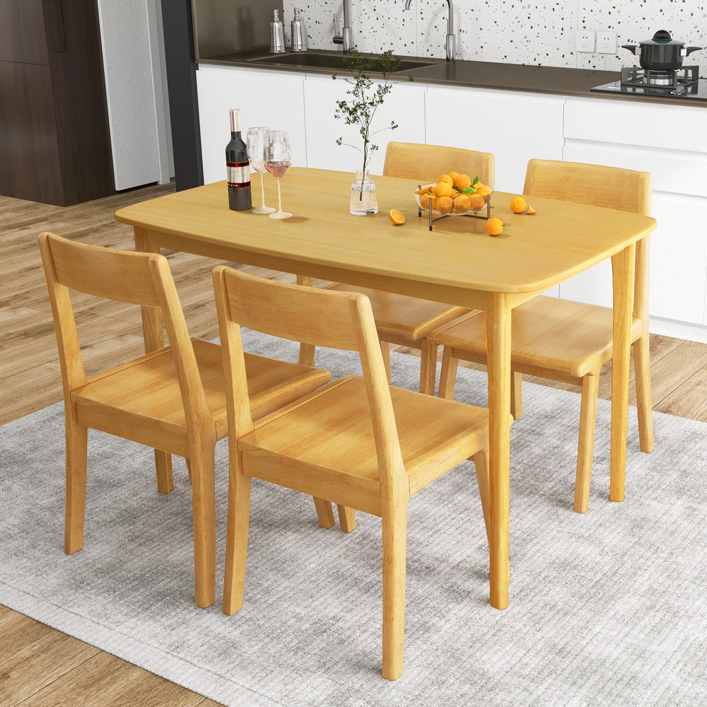 Natural 48-inch dining table with rubber wood supporting legs, offering a spacious area for family meals in the kitchen.