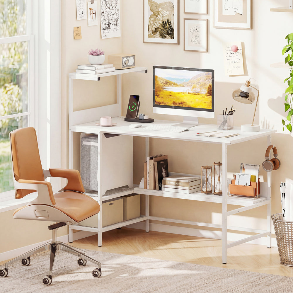 L-shaped 48-inch computer desk in white with power outlets, storage shelves, and a stylish orange office chair.