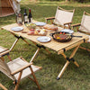 Folding camping table with solid pine wood, 48-inch size, set for outdoor dining, perfect for BBQs and gatherings.