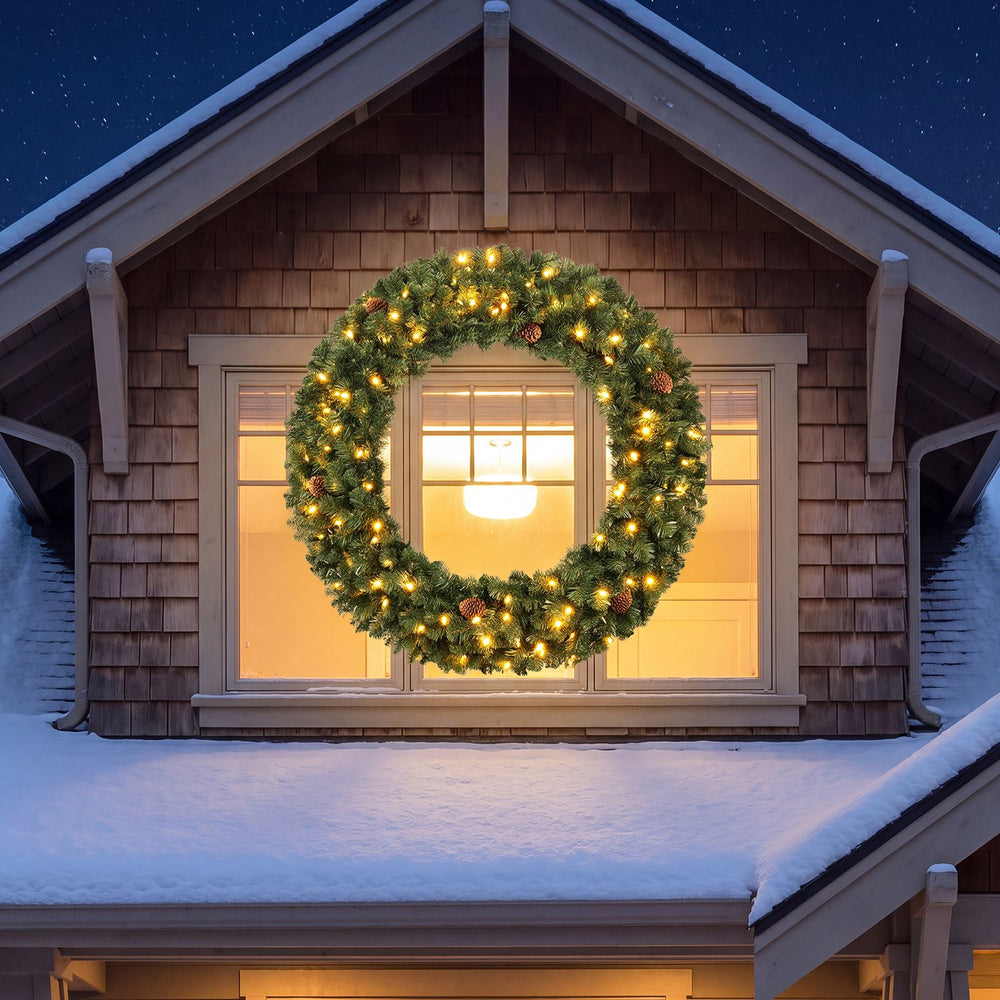 48-inch pre-lit artificial Christmas wreath with 150 warm white LED lights and realistic pine cones for festive decoration.