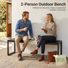 Two-person outdoor bench made of wood-plastic composite and metal, perfect for relaxing chats on patios or porches.