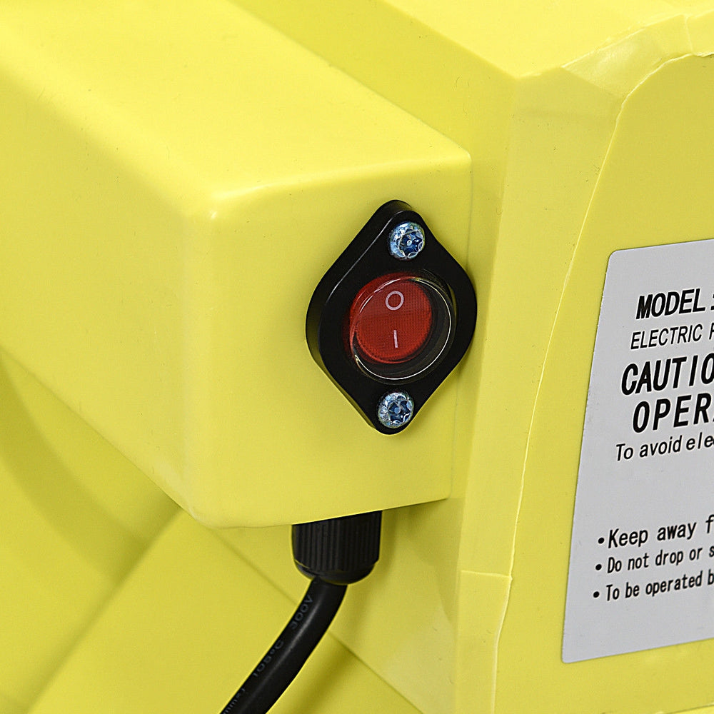 Close-up of the power switch on the 950 W air blower pump for inflatable bounce houses, featuring a durable yellow.