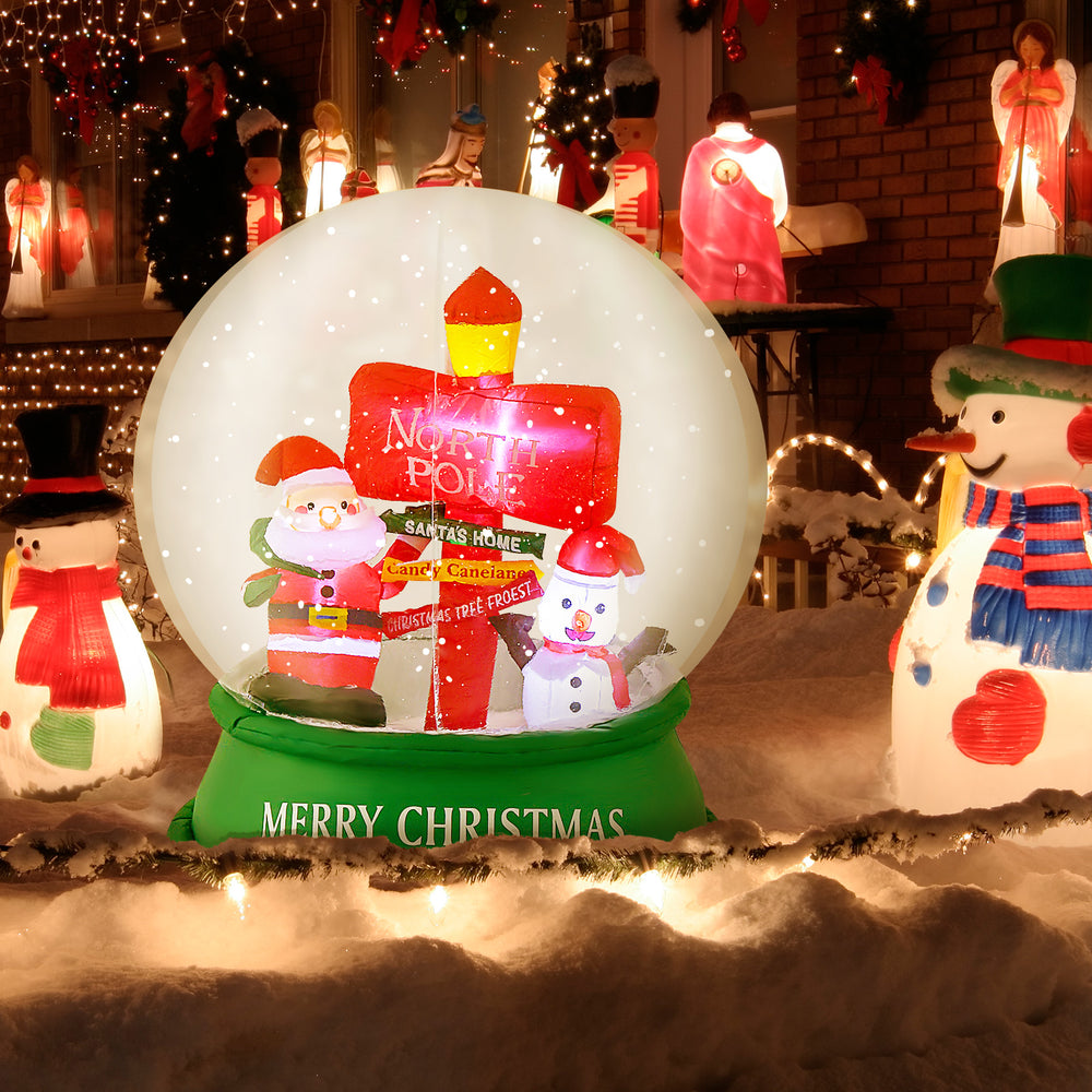 4 feet Christmas inflatable snow globe with Santa and snowman, showcasing a colorful road sign, perfect for holiday.