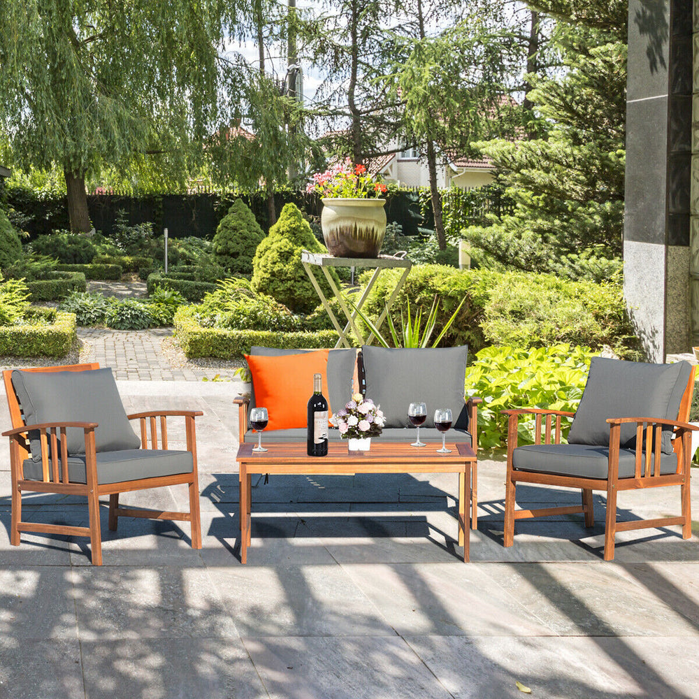 Wooden patio furniture set with cushioned chairs and table, ideal for outdoor garden relaxation and stylish decor.