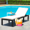 Cushioned white patio rattan lounge chair with adjustable backrest, perfect for poolside relaxation.