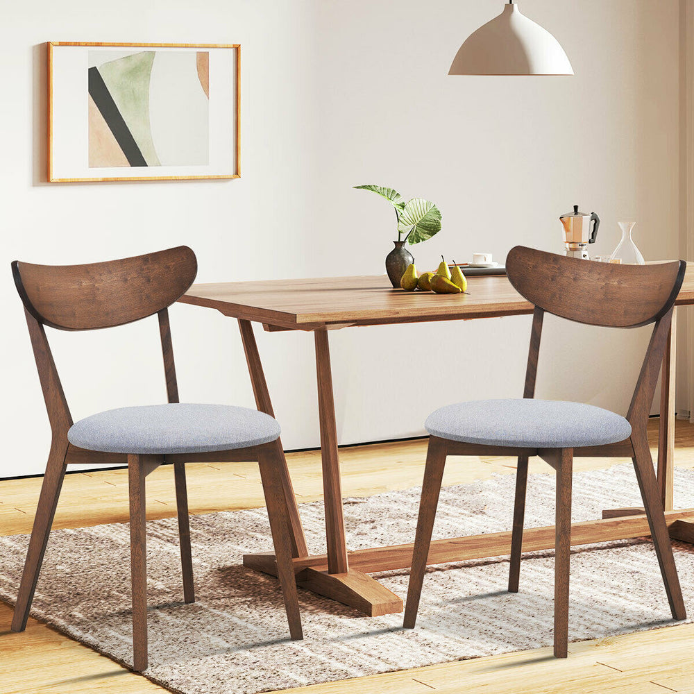 Set of 2 dining chairs with upholstered curved back, rubber wood legs, perfect for kitchen or dining room use.