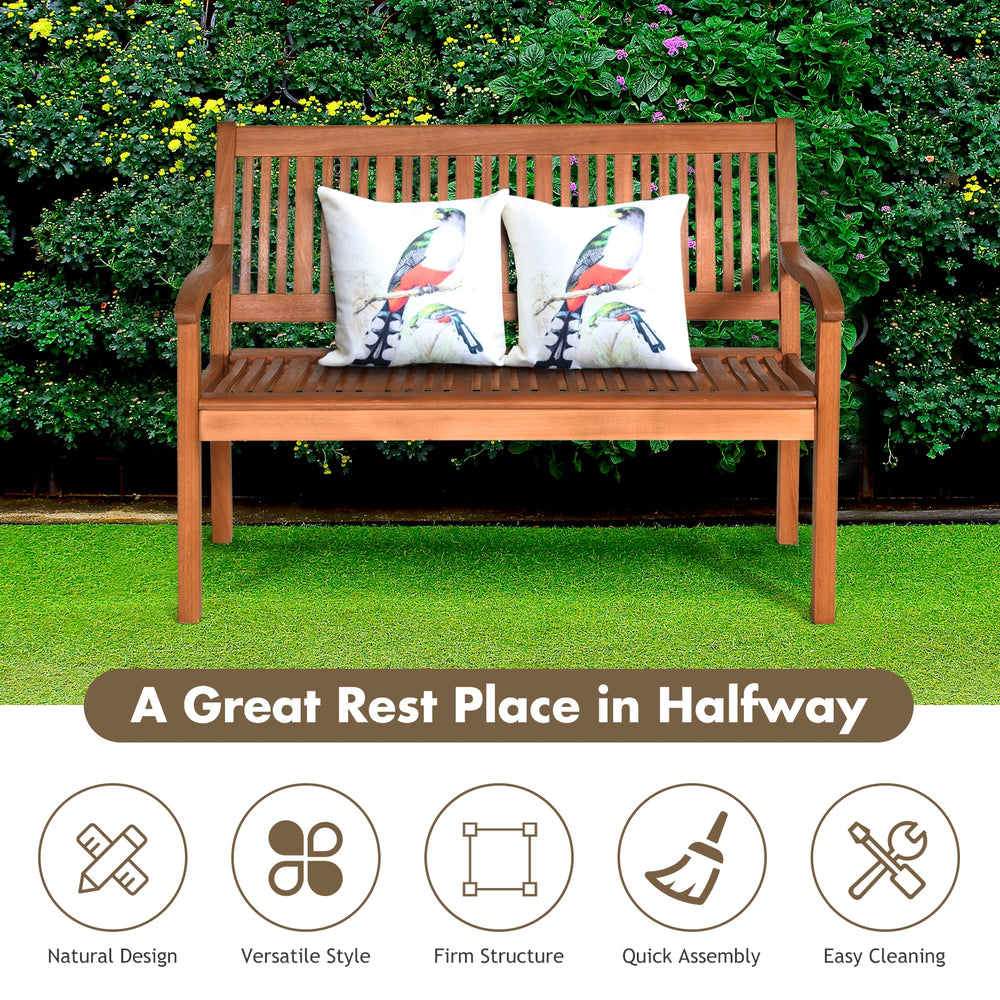 Two-person solid wood garden bench with curved backrest and wide armrest, featuring a natural teak color for outdoor.