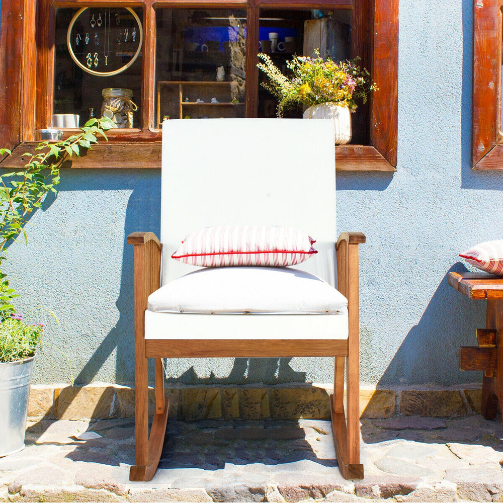 Outdoor acacia wood rocking chair with detachable cushions, featuring a rustic teak color, perfect for patio relaxation.
