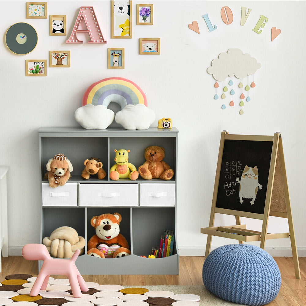 Freestanding gray cubby bin storage organizer with three baskets and two open shelves for children's toys and books.