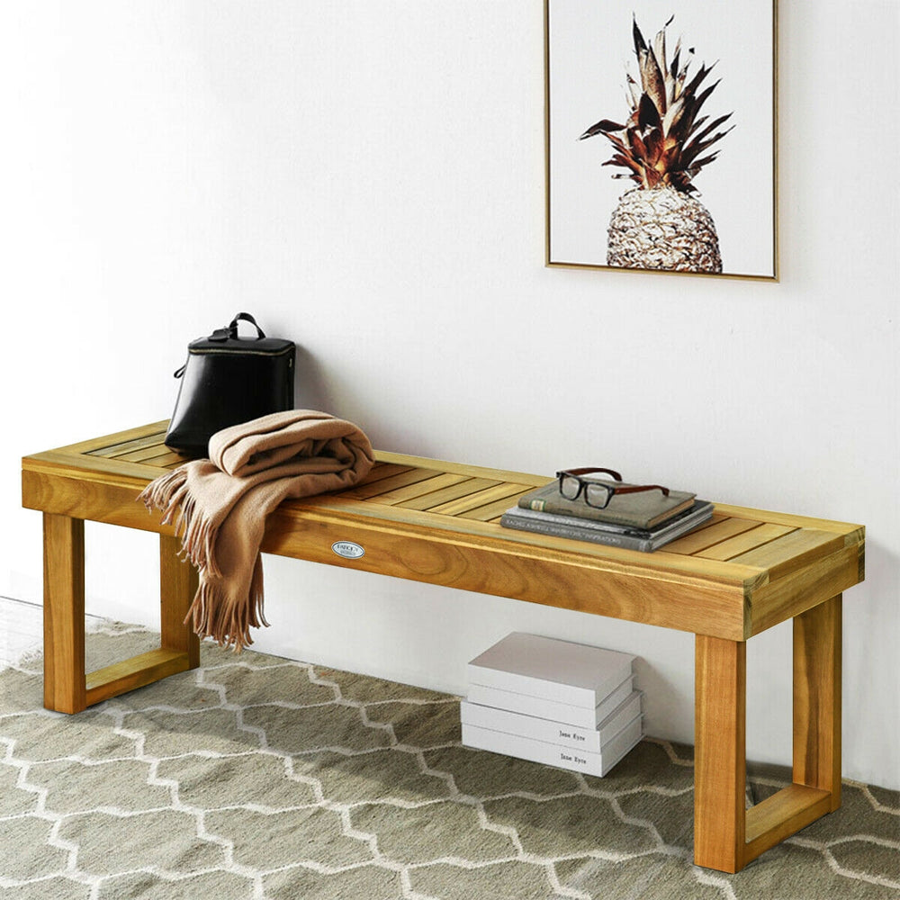 Acacia wood dining bench with slatted seat, natural teak color, perfect for indoor or outdoor casual seating.