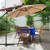 Beige 10 ft patio offset umbrella showcasing a 360° rotation mechanism, positioned beside a dining table and chairs for.
