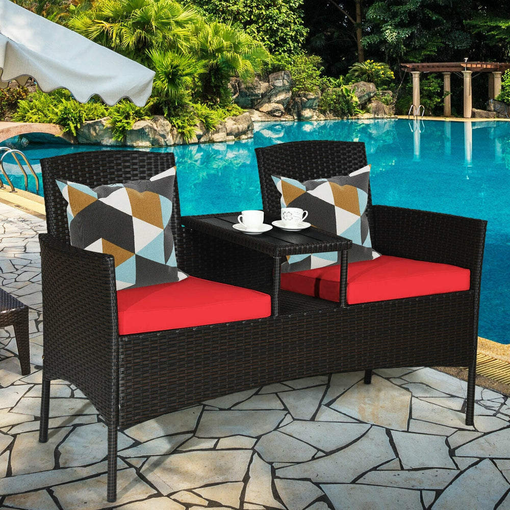 Side view of the Modern Patio Conversation Set showcasing cozy red cushions and a practical trapezoid coffee table.