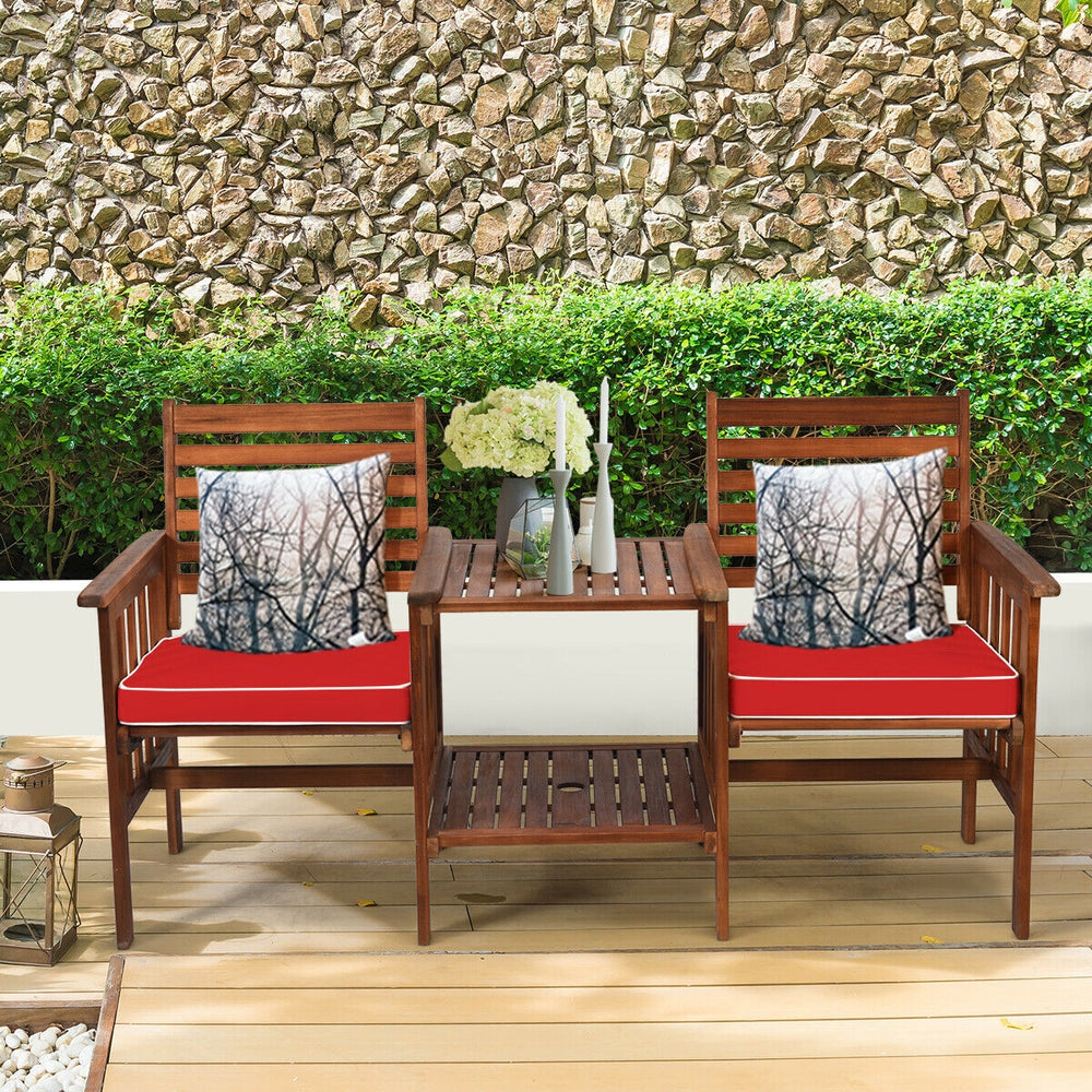 Acacia wood loveseat set with red cushions and coffee table, perfect for outdoor patio relaxation and gatherings.