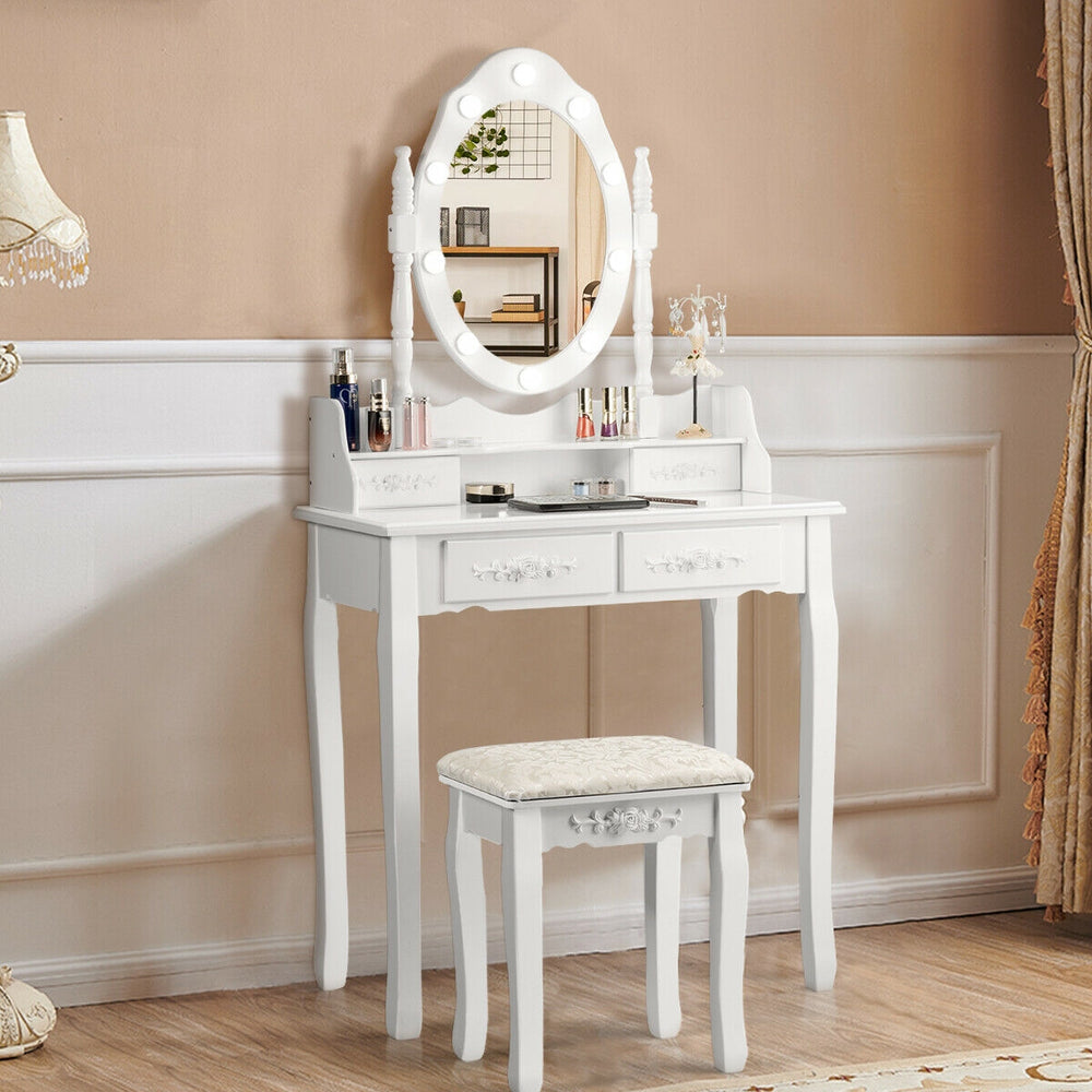 Elegant white makeup vanity dressing table set with a cushioned stool, featuring four drawers and a rotatable mirror.