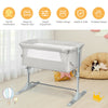 Portable beige baby bedside crib with adjustable height, detachable sidebar, and carrying bag for safe nighttime care.