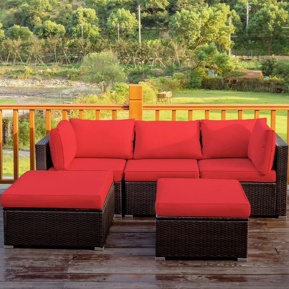 Close-up of the thick sponge padded cushion on a red rattan sofa set, designed for comfort and outdoor enjoyment.