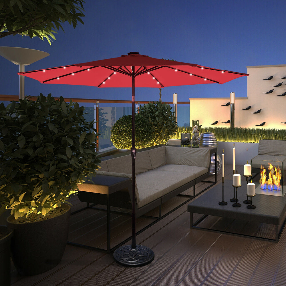 Dark red 10' solar LED lighted patio umbrella with tilt adjustment, perfect for outdoor shading and evening ambiance.