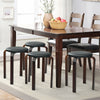Set of 4 stackable black bentwood stools with padded seats, ideal for dining or space-saving solutions.