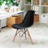Black plastic hollow chair with wood legs, featuring a curved mesh seat for breathability, ideal for dining or office.