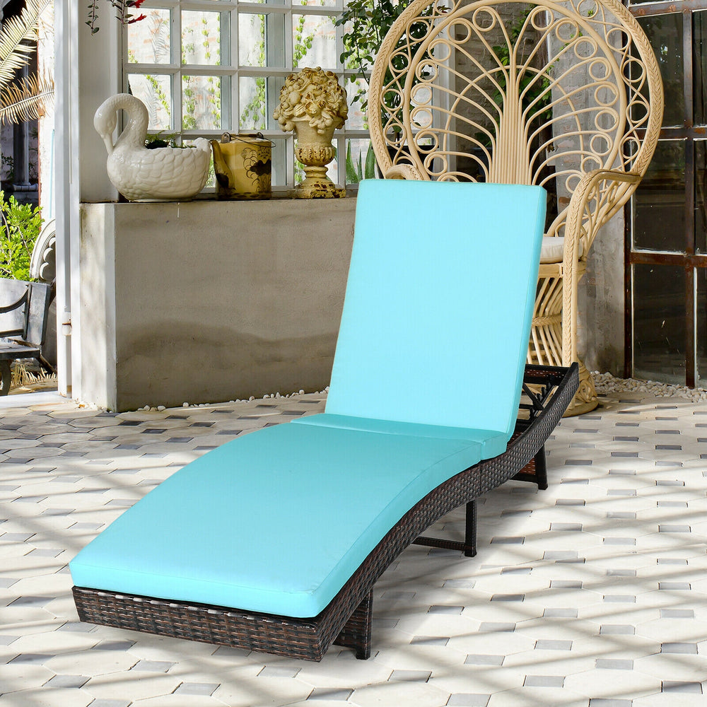 Turquoise patio folding adjustable rattan chaise lounge chair with thick cushion, perfect for garden or poolside.