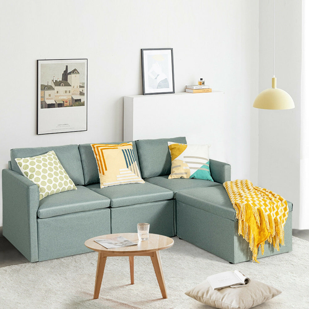 L-shaped sectional sofa in green with reversible chaise, featuring soft linen fabric and thick cushions for comfort.