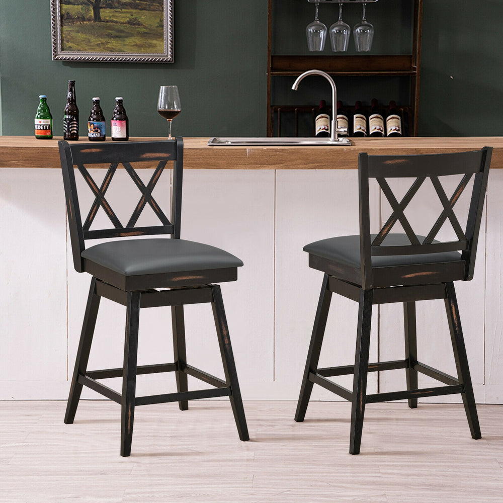 Set of 2 black swivel counter height barstools with rubber wood legs, ideal for home or pub use.