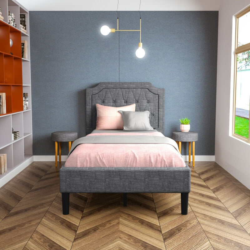 Twin upholstered platform bed with button-tufted headboard, soft fabric, and under-bed storage for a tidy room.