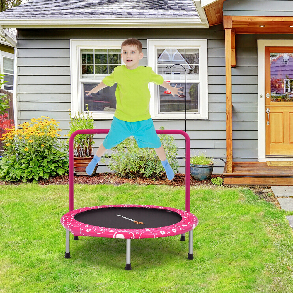 Kids trampoline with pink padded cover and full handrail, ideal for safe bouncing and outdoor play.