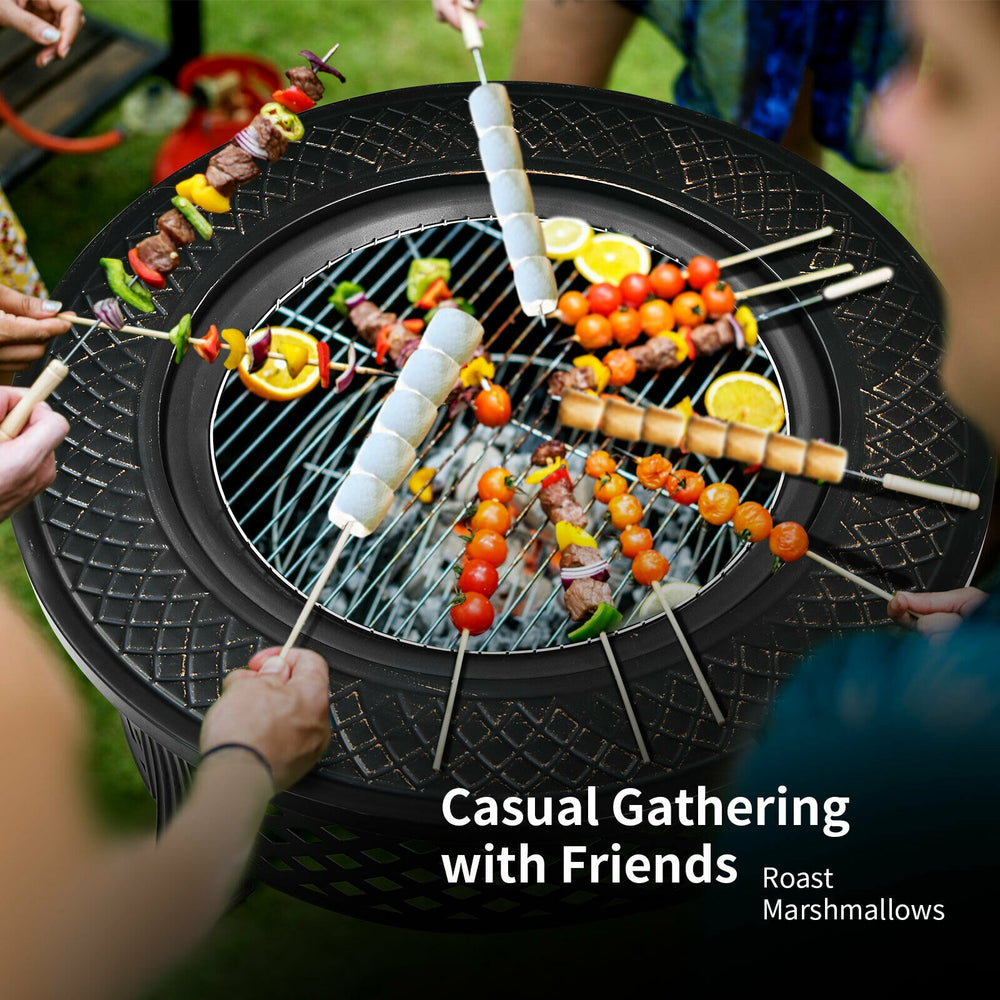 Outdoor fire pit with BBQ grill, featuring skewers and fresh ingredients, perfect for casual gatherings and backyard.