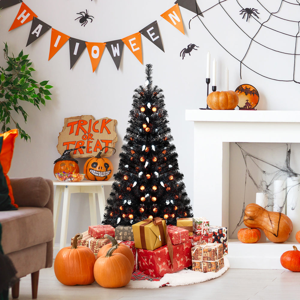 4.5 feet artificial Halloween tree with black leaves, ghost and pumpkin lights, set up for festive decoration.