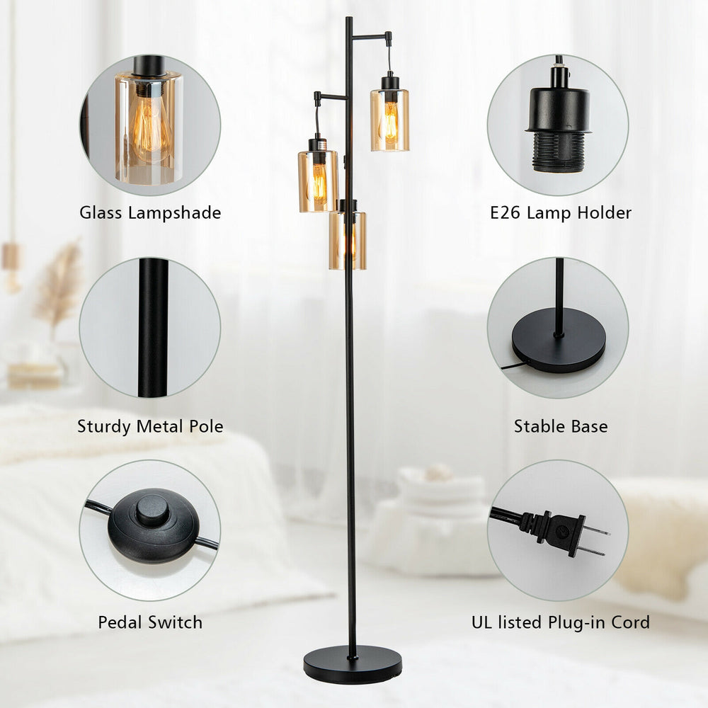 Retro floor lamp with three amber glass shades and a sturdy metal pole, ideal for living rooms and bedrooms.