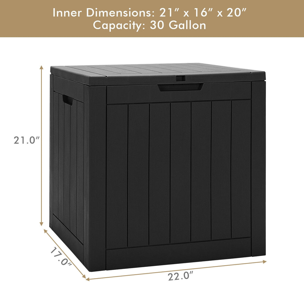 Black 30-gallon deck box with woodgrain surface, lockable lid, and recessed handles for outdoor storage and seating.