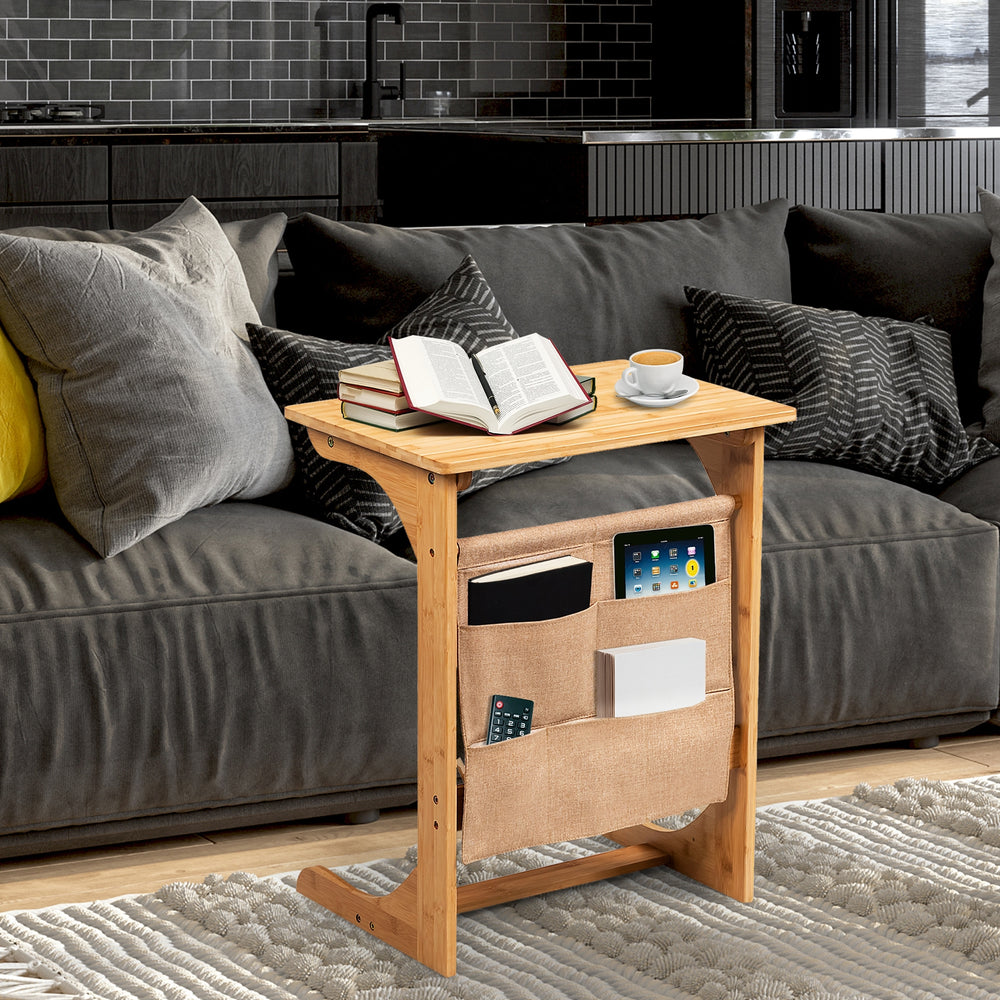 Bamboo sofa table with storage bag, L-shaped design, round corners, perfect for side or coffee table use.