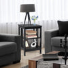 3-tier black nightstand with round corners, featuring open compartments for storage in a stylish living room setting.