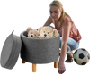 Round gray fabric storage ottoman with removable lid, wooden tray, and non-slip pads, ideal for bedroom organization.