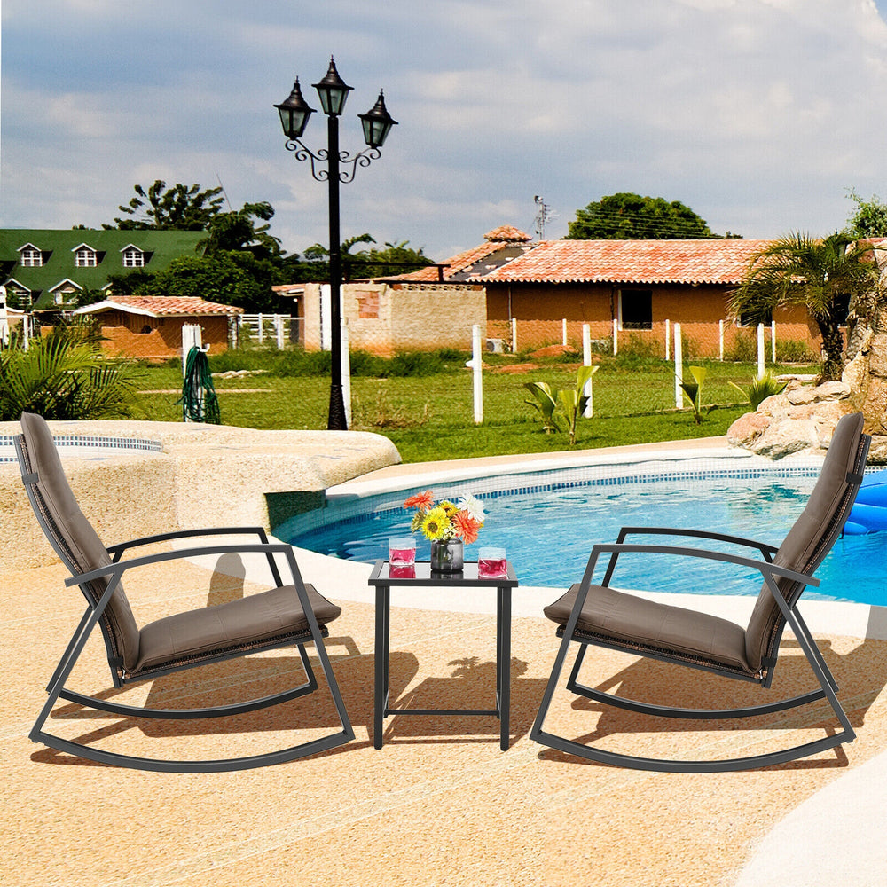 3-piece brown patio rattan rocking furniture set with cushions, ideal for poolside relaxation and outdoor comfort.